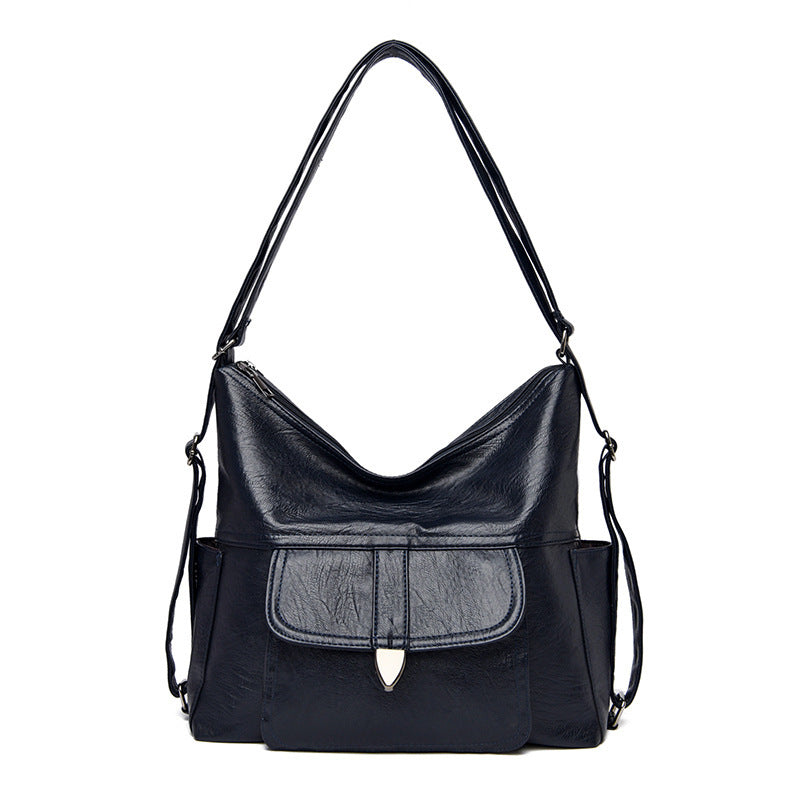 Ladies crossbody shoulder tote bag in faux leather with adjustable strap, available in multiple colours.