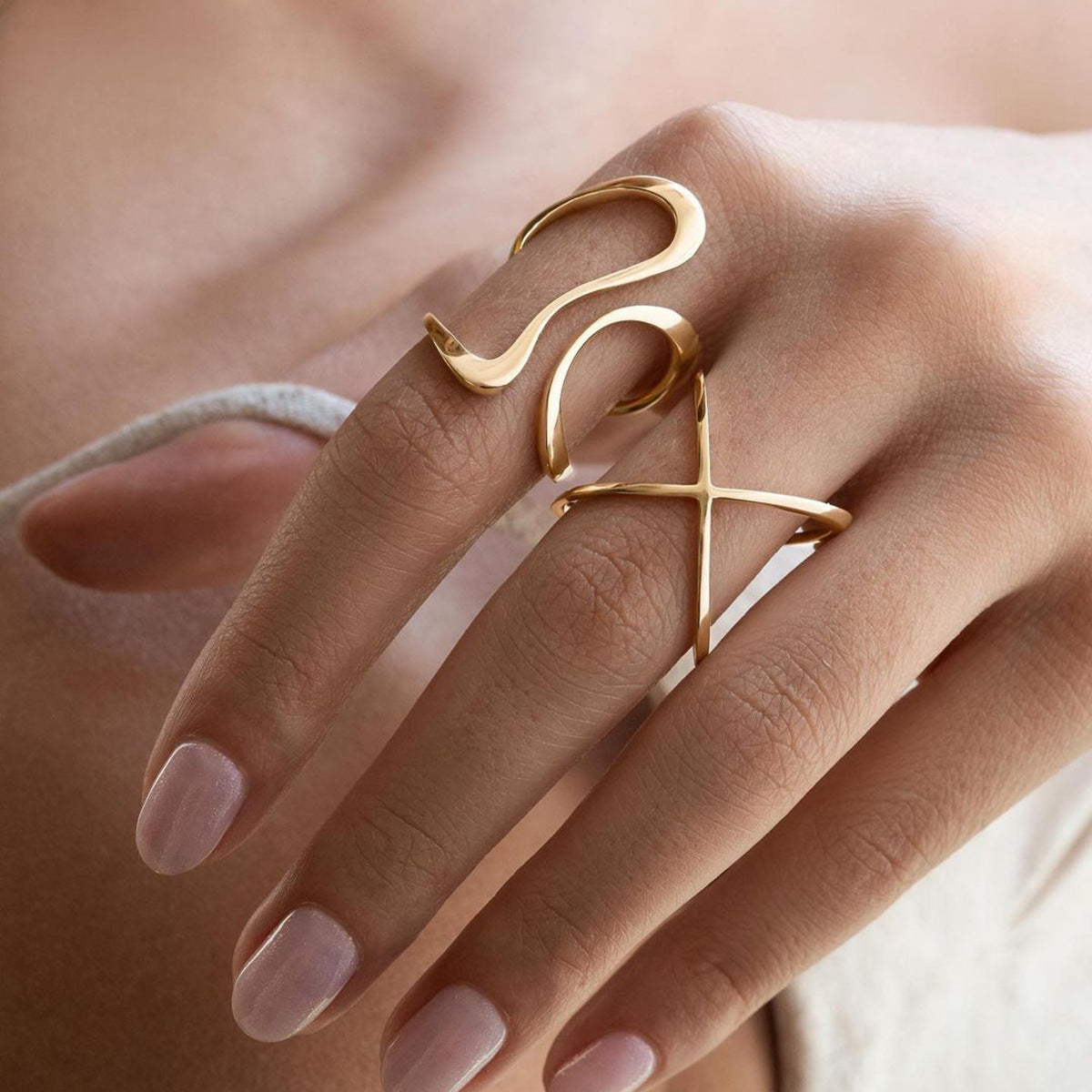 Gold ring on a finger with a blurred background