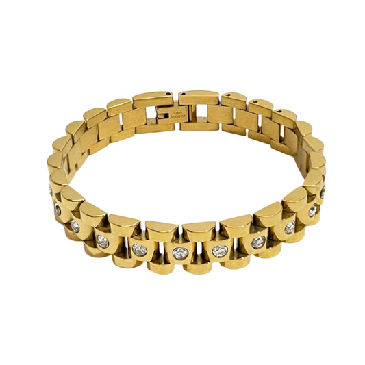 Gold bracelet with diamond accents on a white background