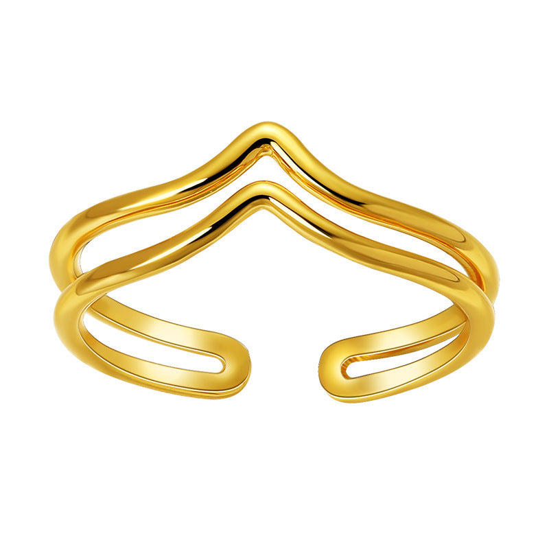 Gold open bangle on a white background