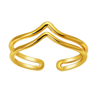 Gold open bangle on a white background