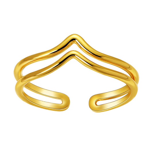 Gold open bangle on a white background