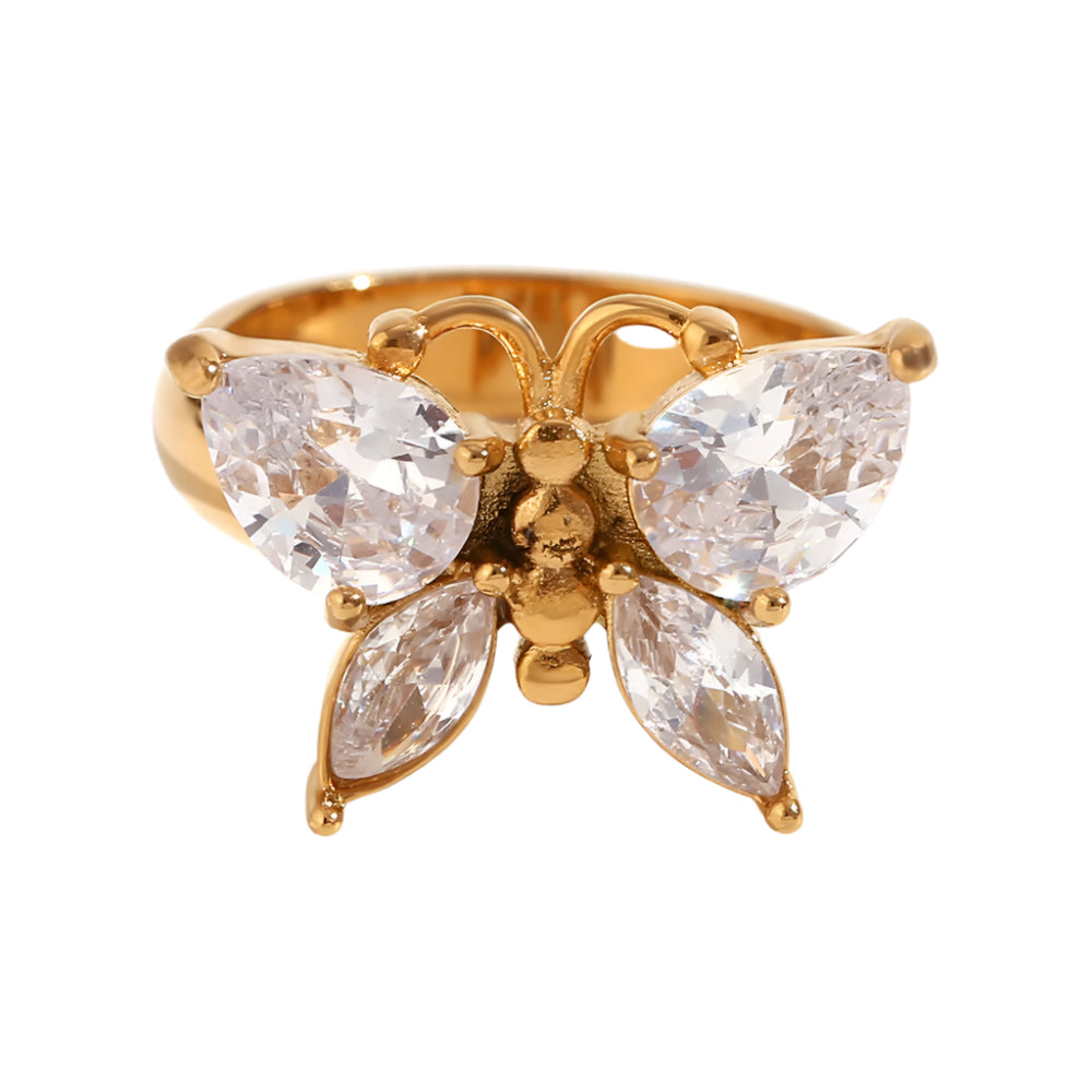 Gold butterfly ring with clear gemstones on a white background