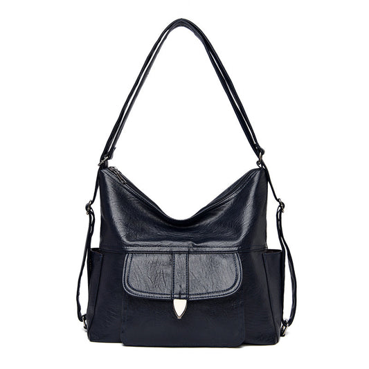 Ladies crossbody shoulder tote bag in faux leather with adjustable strap, available in multiple colours.