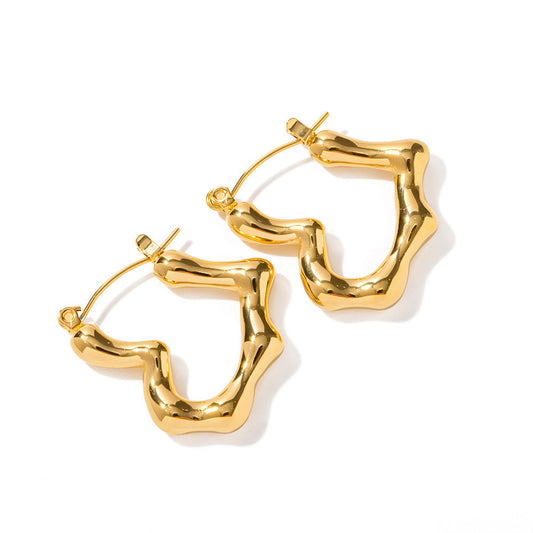 Gold hoop earrings on a white background